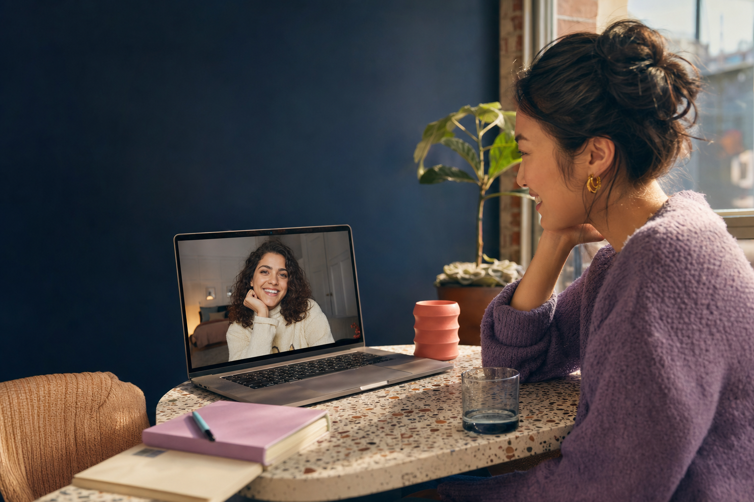 Two friends smiling during a video conversation